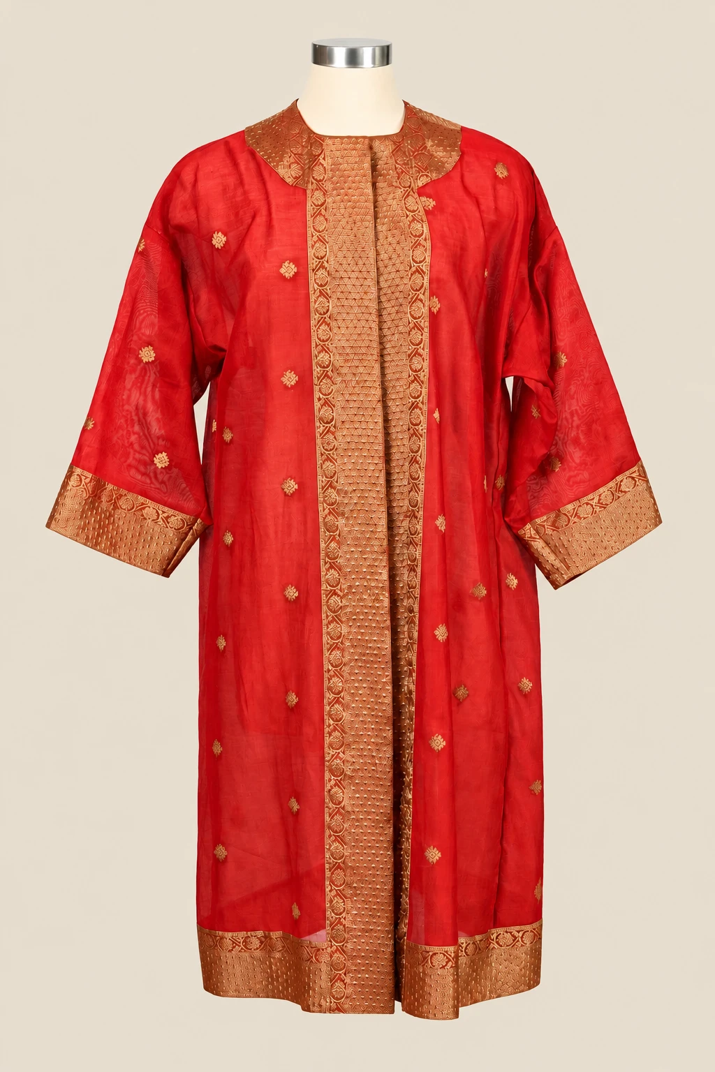 Red Orange & Gold Amara on a cream dress form