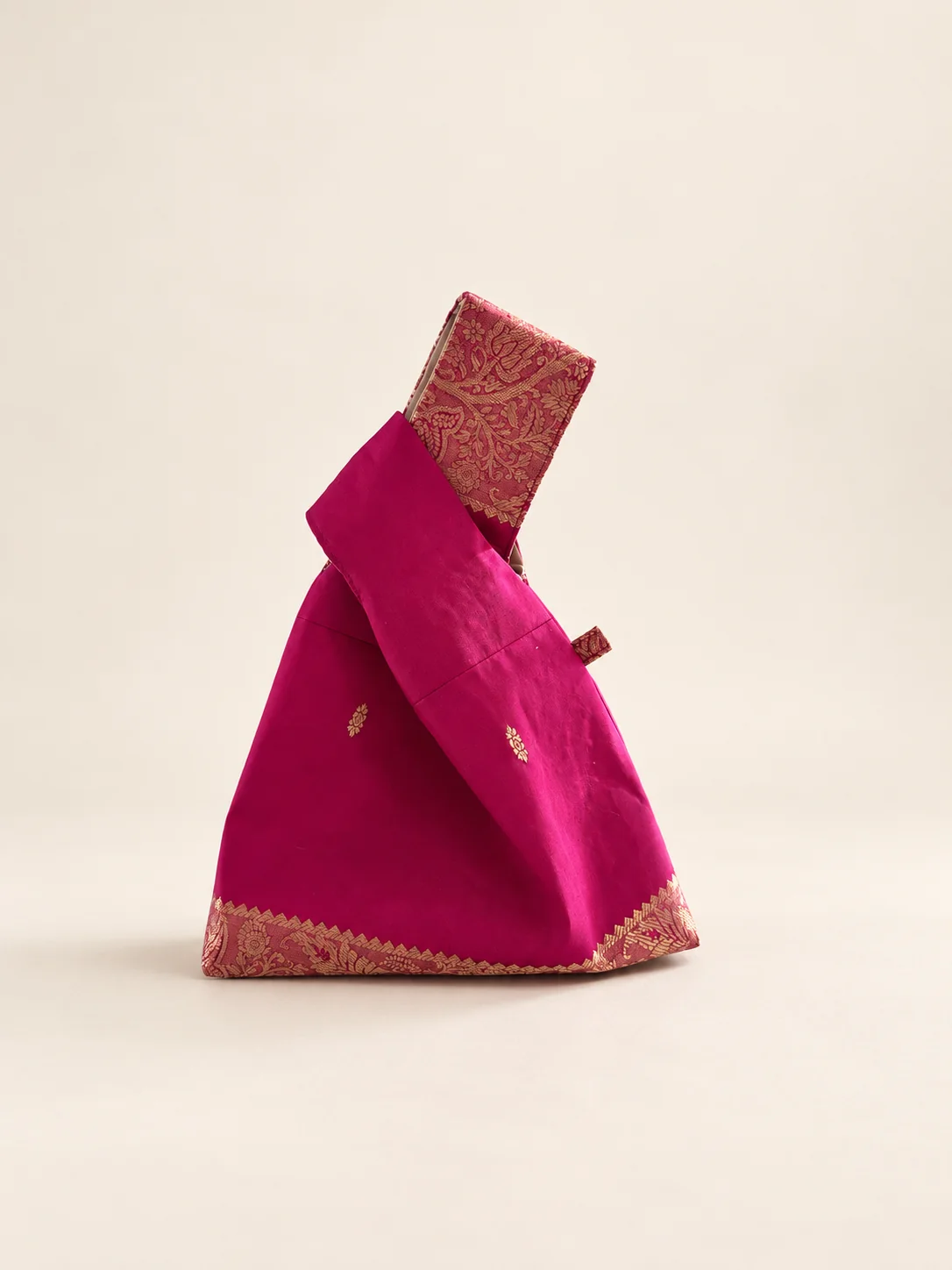 Actual pink Mina silk knot bag with gold woven borders