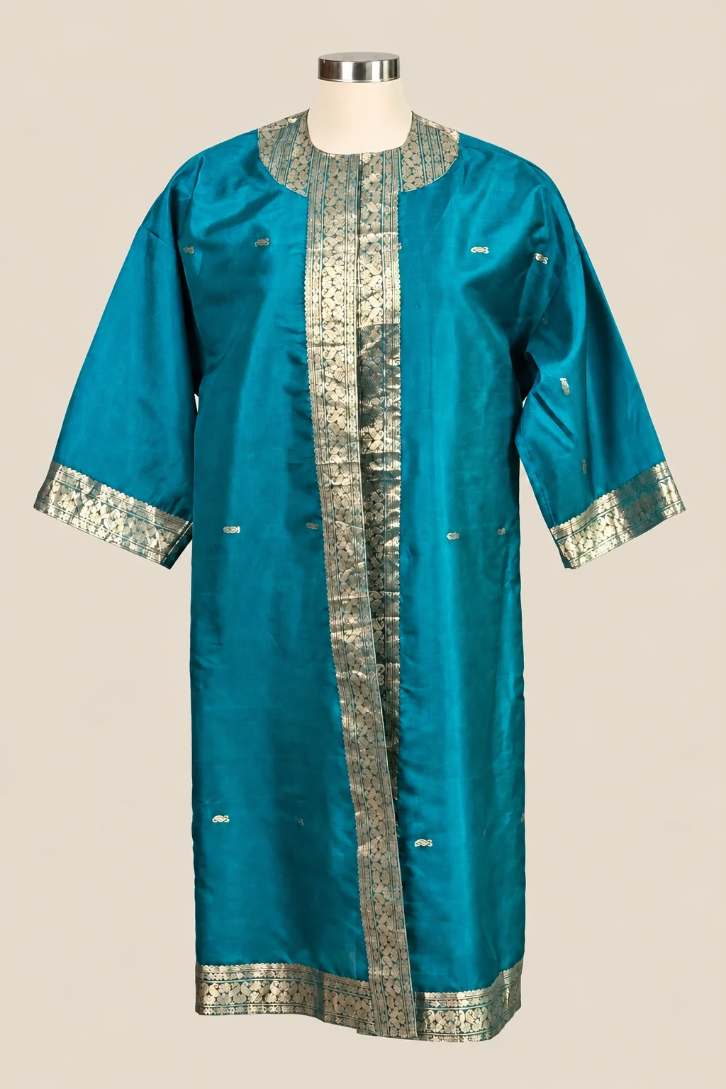 Teal & Gold Amara on a cream dress form
