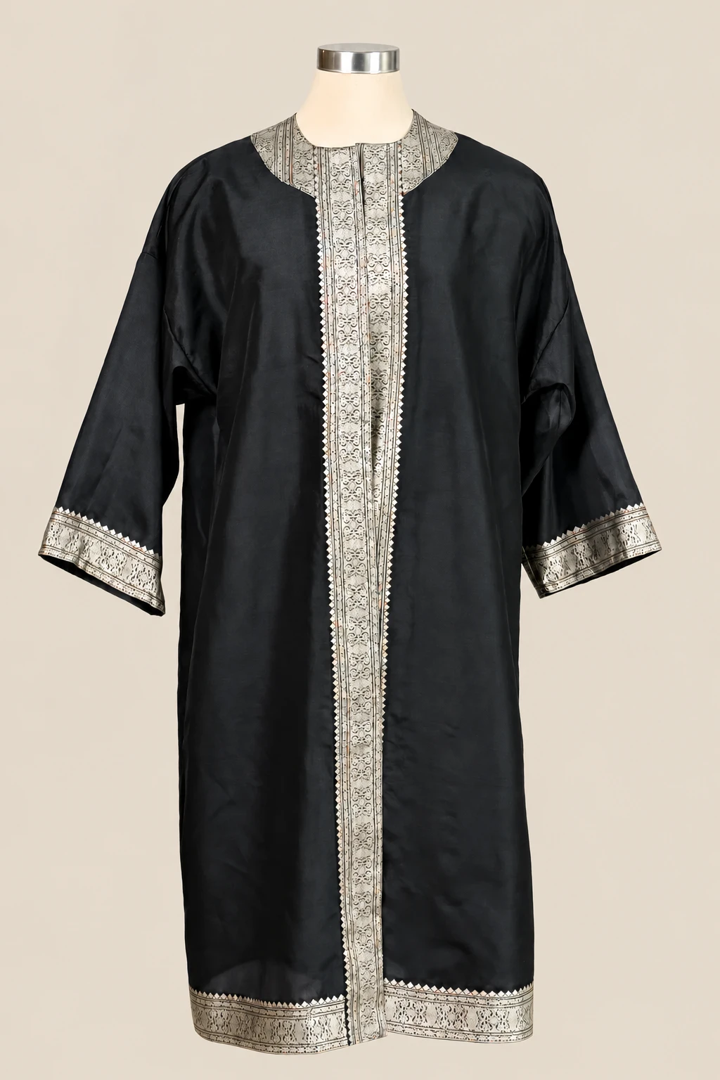 Black Amara on a cream dress form